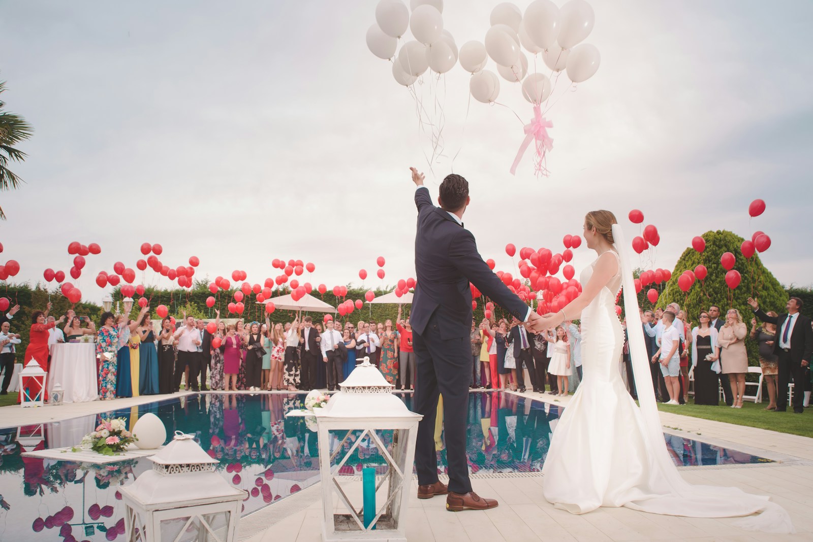 A couple celebrating at an outdoor wedding event